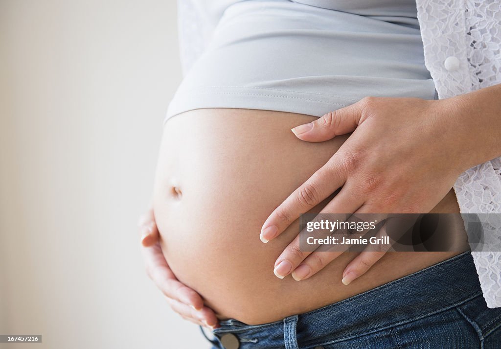 Close-up of pregnant woman's belly