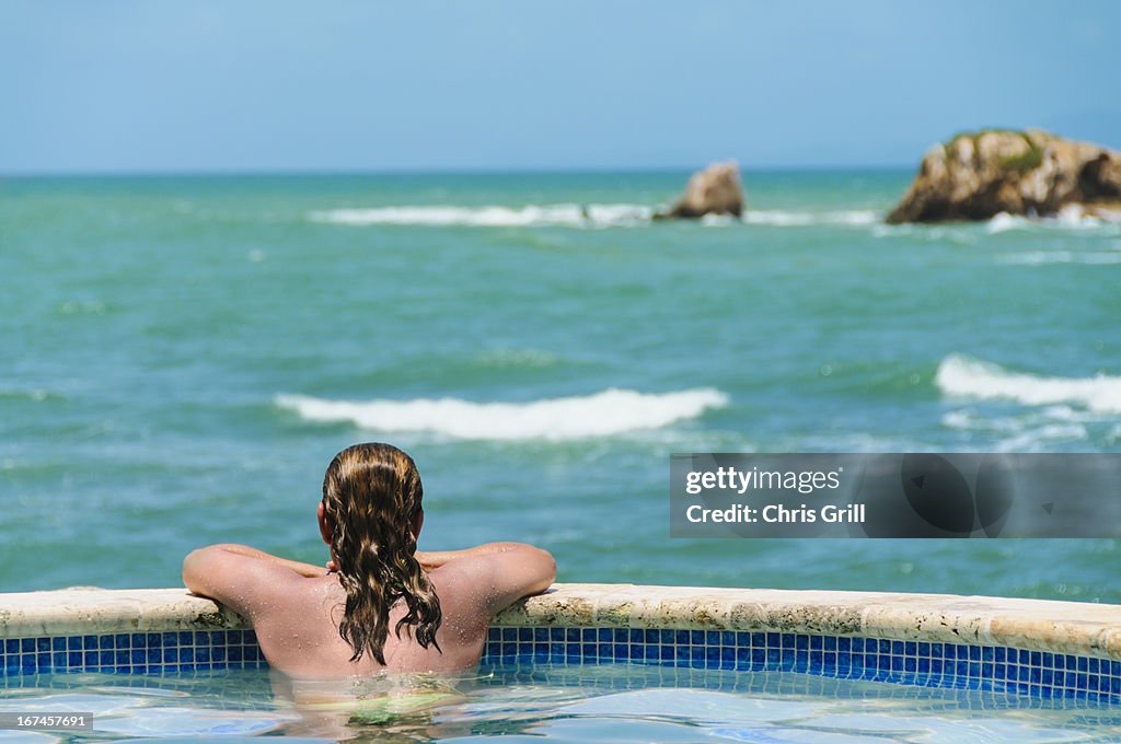 Puerto Rico, Humacao, Rear view of mature woman looking at sea