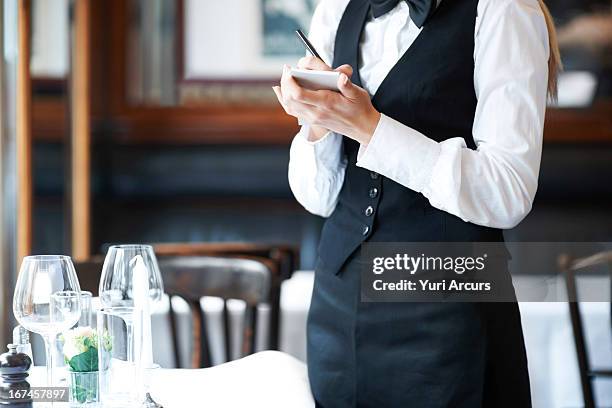 denmark, aarhus, young waitress taking order - camarero fotografías e imágenes de stock