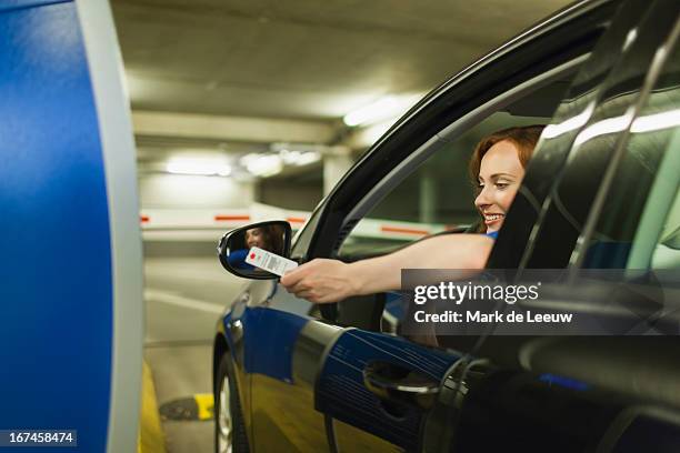 holland, goirle, young woman parking car - parking entrance stock-fotos und bilder