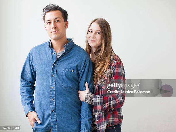 studio shot portrait of young couple - two people studio shot stock pictures, royalty-free photos & images