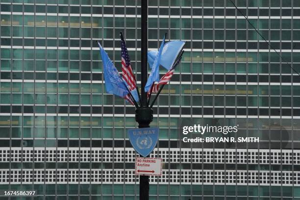 United Nations and US flags fly in front of the United Nations headquarters ahead of the 78th session of the United Nations General Assembly in New...