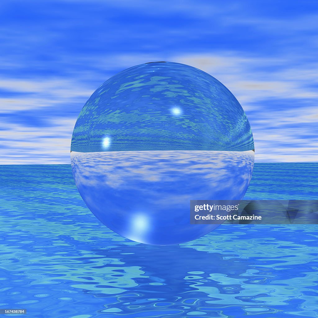 Crystal ball reflecting blue sea and skies