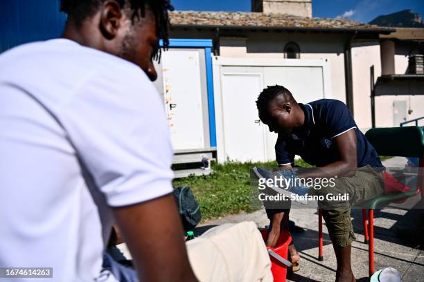 Sudan migrants wash their shoes inside the Rifugio Fraternità Massi on September 11, 2023 in Oulx, Italy. The Rifugio Fraternità Massi of Oulx, Italy...