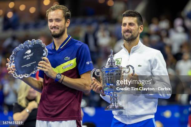 September 10: Novak Djokovic of Serbia with the winners' trophy and Daniil Medvedev of Russia with the runners-up trophy at the trophy presentation...