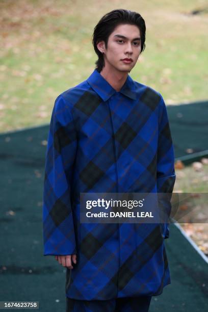 Thai actor Bright Vachirawit arrives to attend the catwalk presentation for British fashion house Burberry's Spring/Summer 2024 collection, at London...