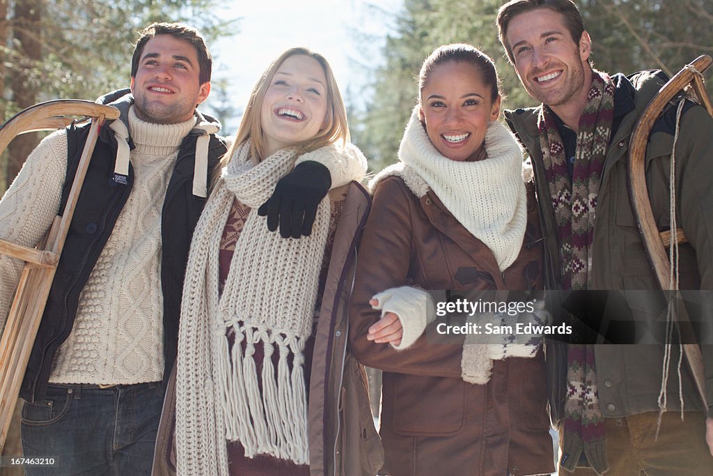 Smiling couples walking in woods