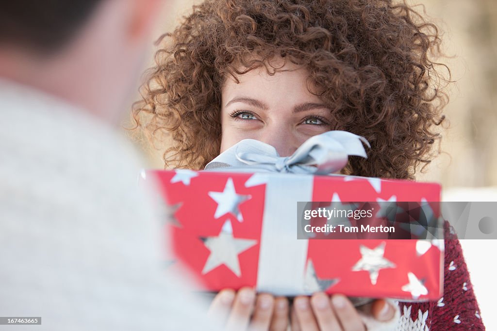 Woman giving man gift