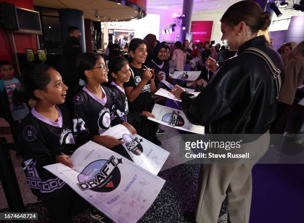 Emily Clark signs autographs on the purple carpet at the inaugural Professional Women's Hockey League Draft at CBC's headquarters in Toronto....