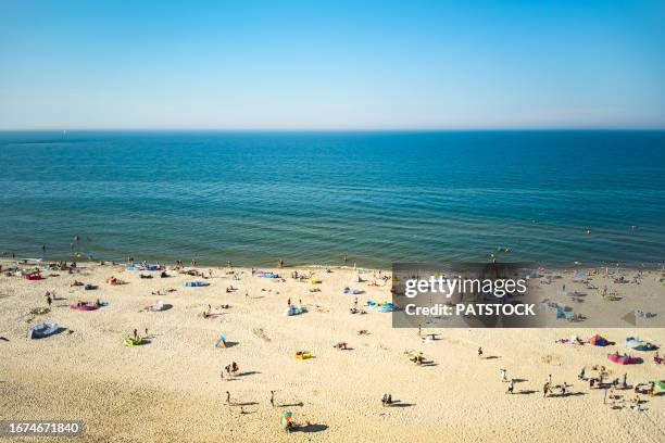 tourists at the beach in summer - pomorskie province stock pictures, royalty-free photos & images
