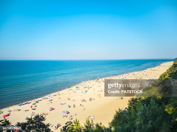 tourists at the beach in summer - pomorskie province stock pictures, royalty-free photos & images
