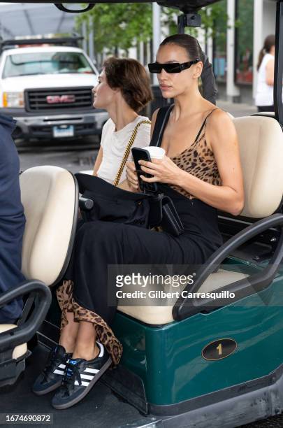 Models Grace Elizabeth and Irina Shayk are seen arriving to the Michael Kors Collection Spring/Summer 2024 Runway Show during New York Fashion Week...