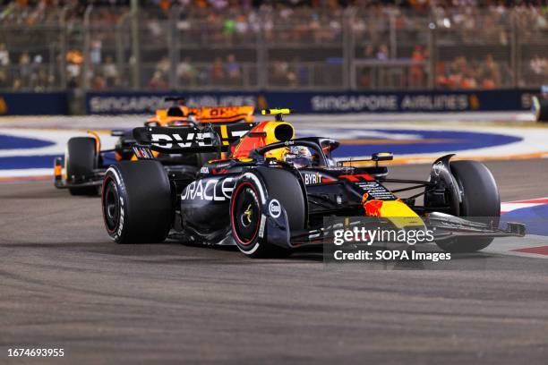 Sergio Perez of Mexico drives the Oracle Red Bull Racing RB19 during the F1 Grand Prix of Singapore at the Marina Bay Street circuit.