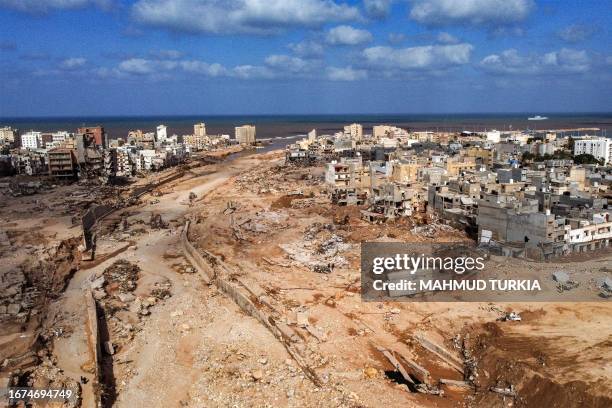 An aerial view shows Libya's eastern city of Derna on September 18 following deadly flash floods. A week after a tsunami-sized flash flood devastated...