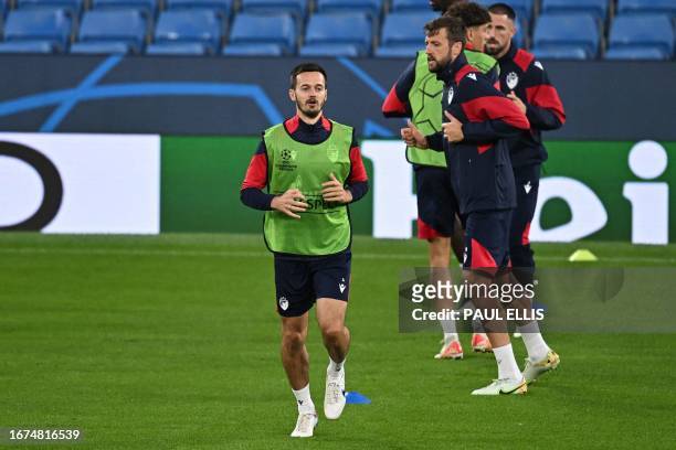 Red Star's Montenegran midfielder Mirko Ivanic attends a team training session at the Etihad Stadium in Manchester, north west England on September...