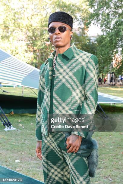 Wizkid attends the Burberry Spring Summer 2024 show during London Fashion Week on September 18, 2023 in London, England.