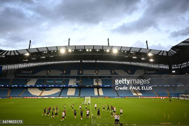 Red Star's players attend a team training session at the Etihad Stadium in Manchester, north west England on September 18 on the eve of the UEFA...