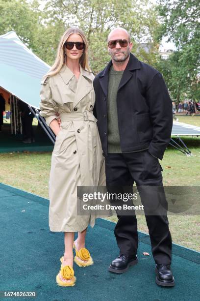 Rosie Huntington-Whiteley and Jason Statham attend the Burberry Spring Summer 2024 show during London Fashion Week on September 18, 2023 in London,...