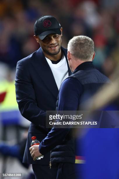 Burnley's Belgian manager Vincent Kompany shakes hands with Nottingham Forest's Welsh manager Steve Cooper ahead of kick-off in the English Premier...