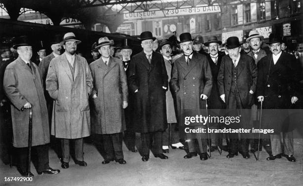The arrival at Victoria Station where Prime Minister Ramsay MacDonald had gathered to greet them. Von Left to Right: Arthur Henderson; Dino Grandi;...