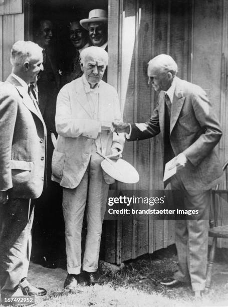 Henry Ford and Thomas Edison . In the background the wooden shed where Thomas Edison created the first light bulb. The shed will be part of the Henry...