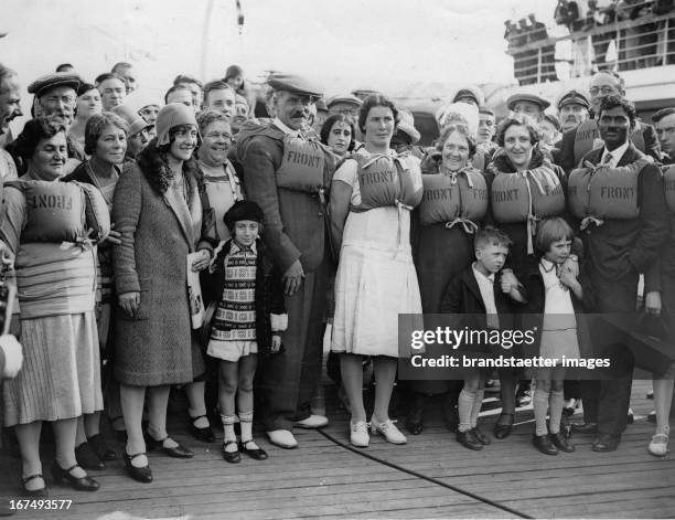 British Prime Minister James Ramsay MacDonald with his daughter Ishbel during a boat drill on a ship on the way to USA. 29th September 1929....