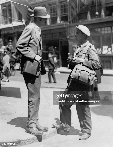 Rowland and Murray Brook. They left London in 1926 to more than 10,000 miles by bicycle or on foot to cover. The picture shows how the two of them...