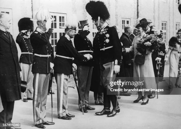 King Christian X and Queen Alexandrine of Denmark greeting some officers in Rosenburg. Christan X is celebrating his 50th anniversary in the Danish...