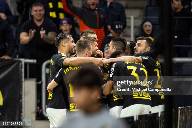 Players from AIK celebrate after Abdihakin Ali scored their team's second goal during an Allsvenskan match between AIK and Degerfors IF at Friends...