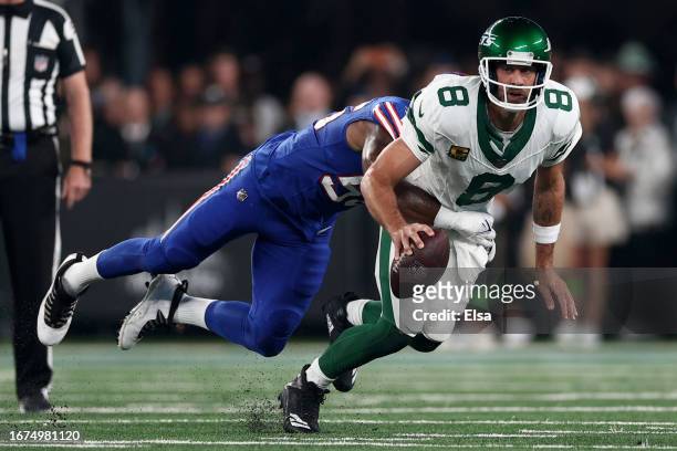 Quarterback Aaron Rodgers of the New York Jets sacked by defensive end Leonard Floyd of the Buffalo Bills during the first quarter of the NFL game at...