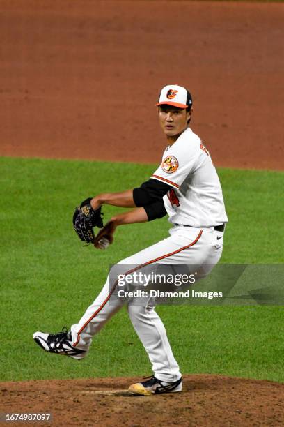 Shintaro Fujinami of the Baltimore Orioles throws a pitch during the sixth inning against the New York Yankees at Oriole Park at Camden Yards on July...