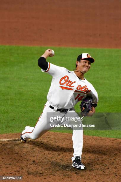 Shintaro Fujinami of the Baltimore Orioles throws a pitch during the sixth inning against the New York Yankees at Oriole Park at Camden Yards on July...