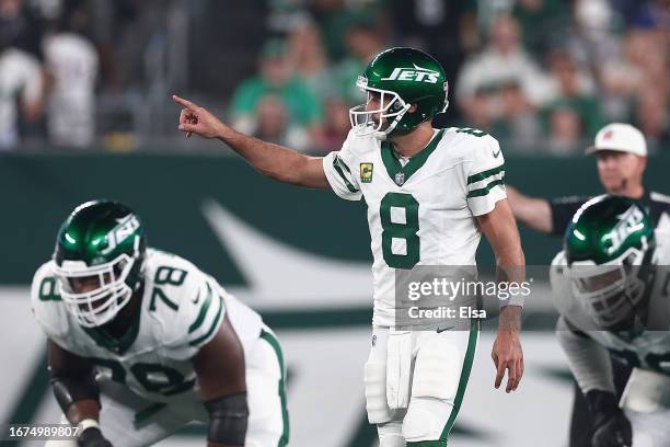 Quarterback Aaron Rodgers of the New York Jets prepares to snap the football during the first quarter of the NFL game against the Buffalo Bills at...