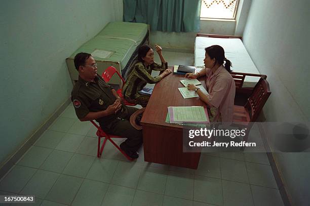 Psychiatrist having a counseling session with an army officer and his wife at the Preah Norodom Sihanouk Hospital in Phnom Penh. The wife suffers...