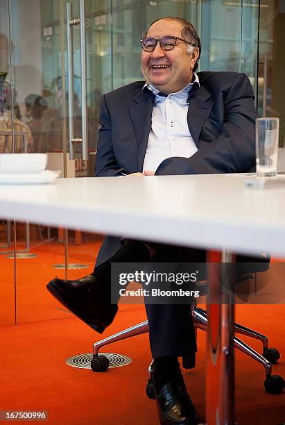 Russian billionaire Alisher Usmanov laughs during a Bloomberg interview in Moscow, Russia, on Thursday, April 25, 2013. Usmanov, Russia's wealthiest...