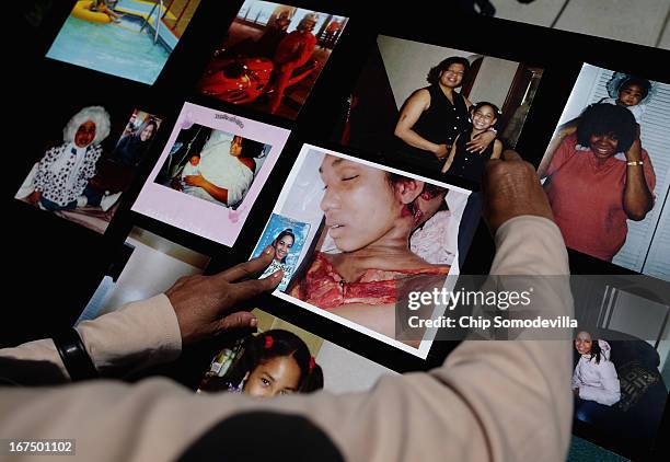 Linda Jefferies displays photographs of her granddaughter Brishell Jones' childhood as well as an image of her after she was shot and killed in 2010...