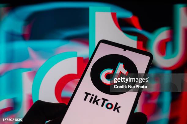 TikTok displayed on a smartphone with TikTok Icon seen in the background, in this photo illustration. On 18 September 2023, in Brussels, Belgium.