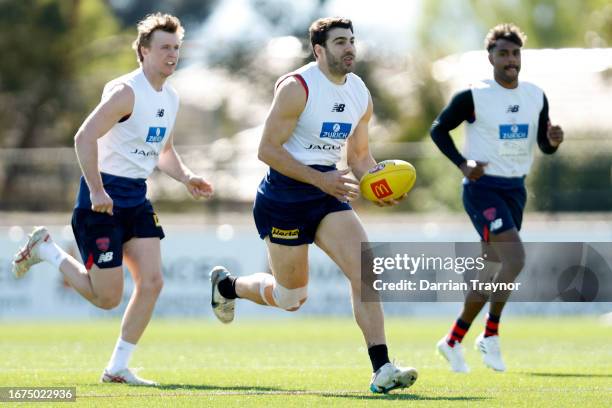 Christian Petracca of the Demons runs with the ball during a Melbourne Demons AFL training session at Casey Fields on September 12, 2023 in...