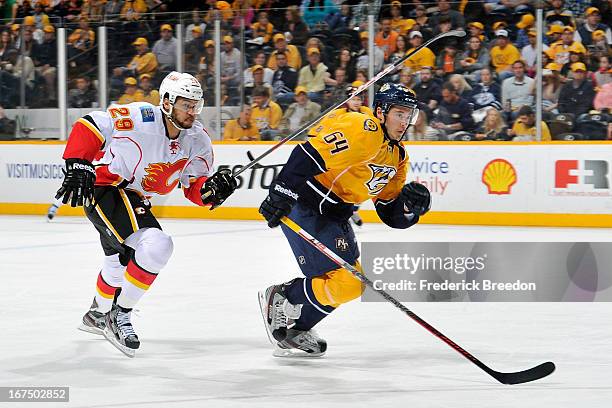 Victor Bartley of the Nashville Predators plays against Akim Aliu of the Calgary Flames at the Bridgestone Arena on April 23, 2013 in Nashville,...