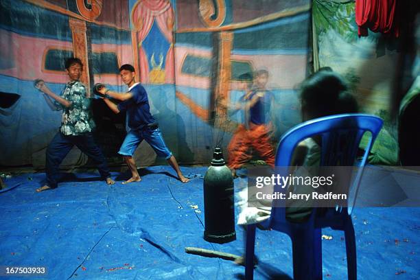 Boys practice traditional Khmer dance at the Cambodian Light Children Association. The orphanage tries to support itself through public performances...