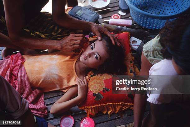 So Ni Ta has her makeup applied for a traditional Khmer dance performance later in the day. She will be joined by other kids from the Cambodian Light...