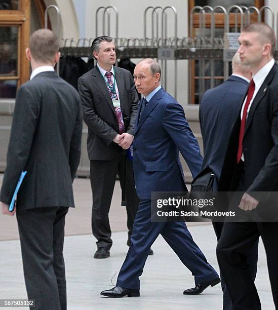 Russsian President Vladimir Putin leaves his annual live broadcast call-in show on Russian television surrounded by his bodyguards on April 25, 2013...