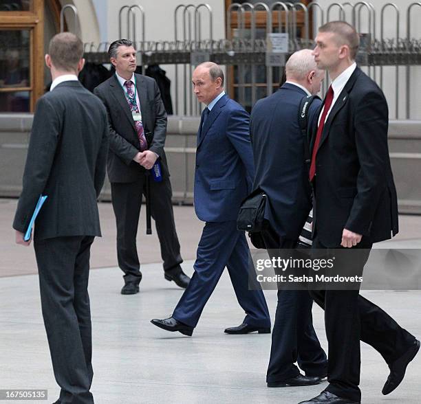 Russsian President Vladimir Putin leaves his annual live broadcast call-in show on Russian television surrounded by his bodyguards on April 25, 2013...