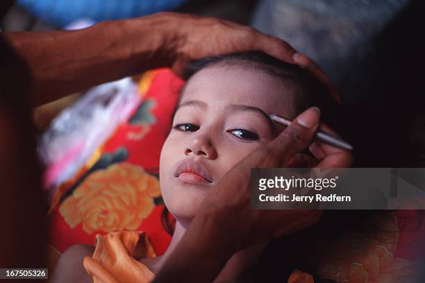 So Ni Ta has her makeup applied for a traditional Khmer dance performance later in the day. She will be joined by other kids from the Cambodian Light...