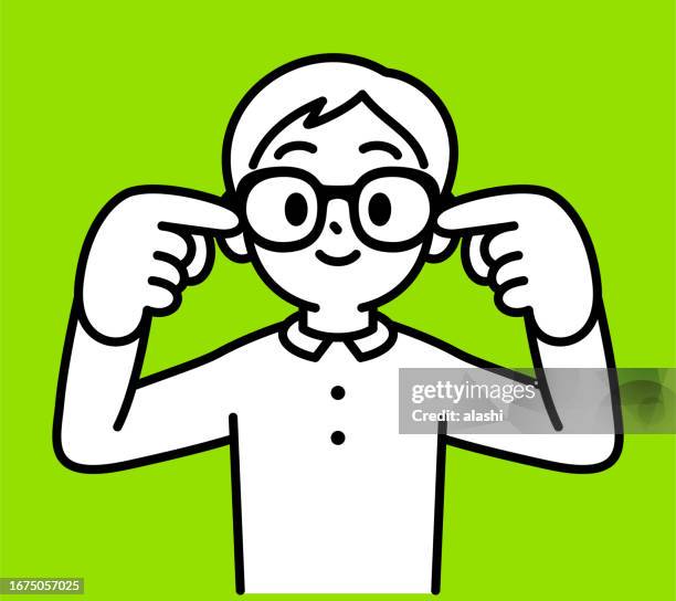 a boy wearing horn-rimmed glasses with his forefingers in his ears, hearing no evil, looking at the viewer, no fake news, minimalist style, black and white outline - fingers in ears stock illustrations