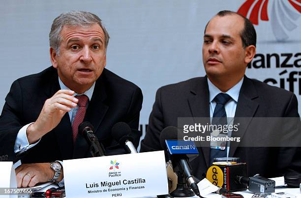 Felipe Larrain, Chile's finance minister, left, speaks as Luis Miguel Castilla, Peru's finance minister, listens during a press conference at the...