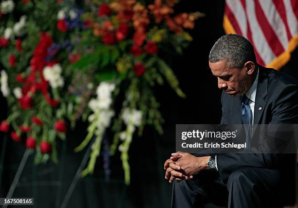 President Barack Obama bows his head at the West memorial service held at Baylor University April 25, 2013 in Waco, Texas. The memorial service...