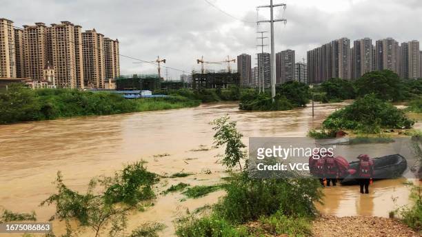 Firefighters evacuate flood-stranded people amid torrential rains on September 11, 2023 in Bobai County, Yulin City, Guangxi Zhuang Autonomous Region...