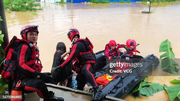 Firefighters evacuate flood-stranded people amid torrential rains on September 11, 2023 in Bobai County, Yulin City, Guangxi Zhuang Autonomous Region...