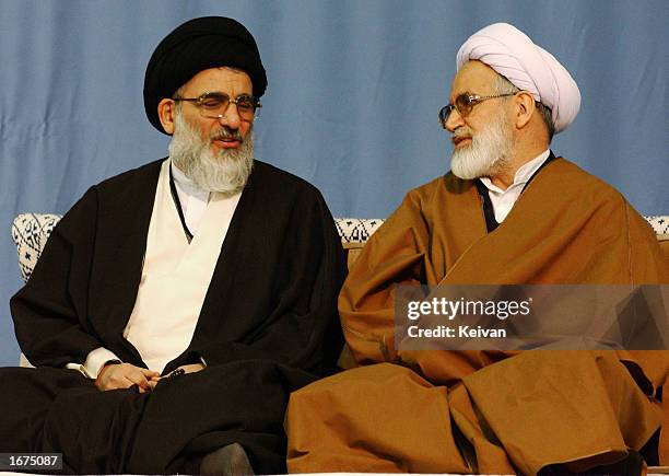 Iranain reformist Parliament Speaker Mehdi Karroubi speaks with hardline Judiciary Chief Mahmood Shahroudi at Tehran's Imam Khomeini December 6, 2002...